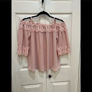 Off the shoulder pink top.